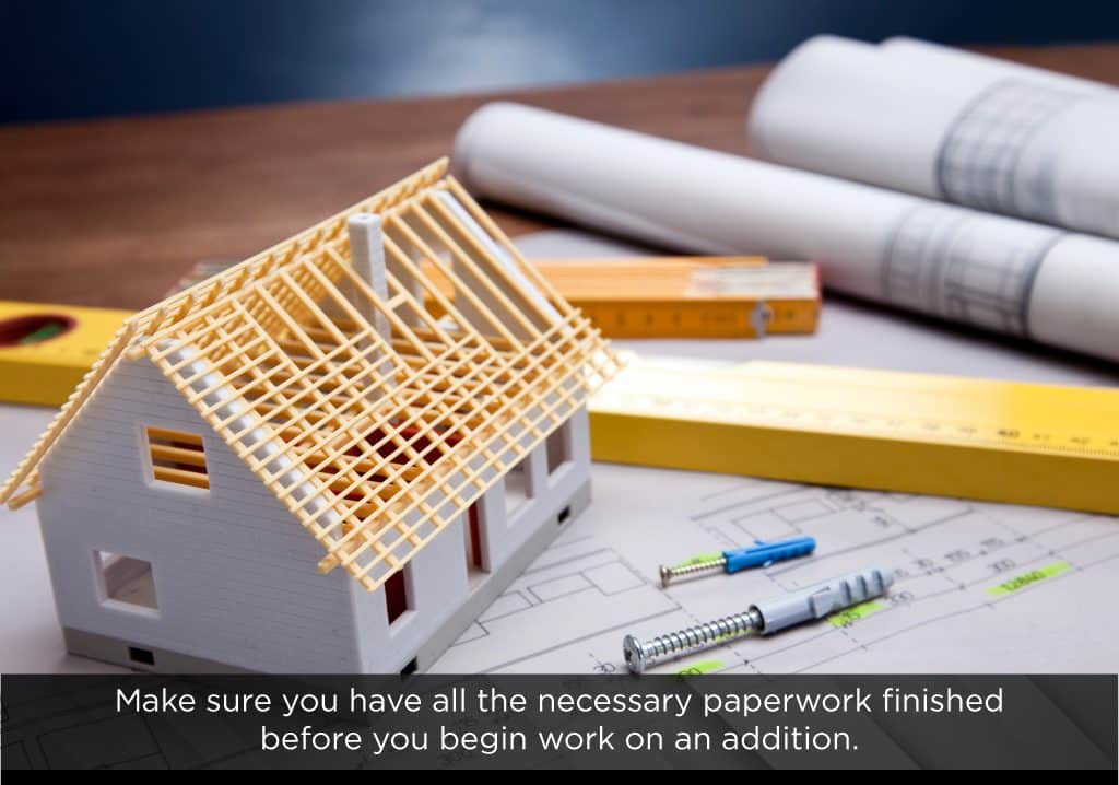 Ensure all paperwork is finished before beginning a home addition